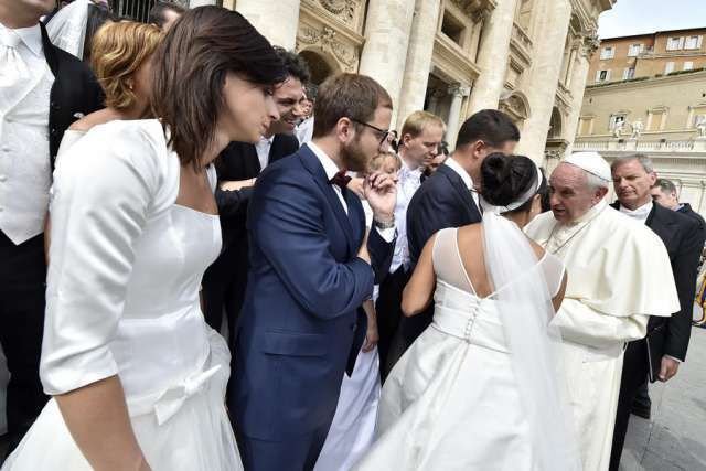 Newly married couples meet Pope Francis in St. Peter's Square on Sept. 9