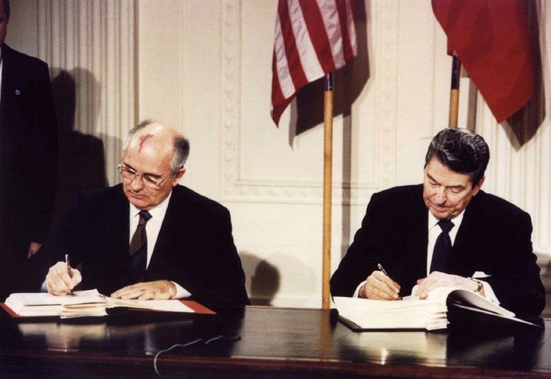 Soviet President Mikhail Gorbachev and U.S. President Ronald Reagan sign the Intermediate-Range Nuclear Forces treaty at the White House in Washington. D.C.