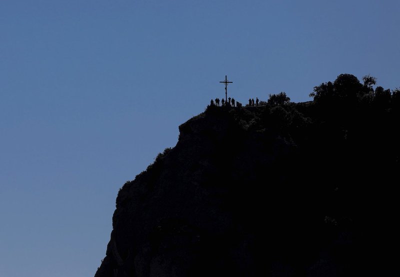 The cross of St. Michael is seen in Montserrat