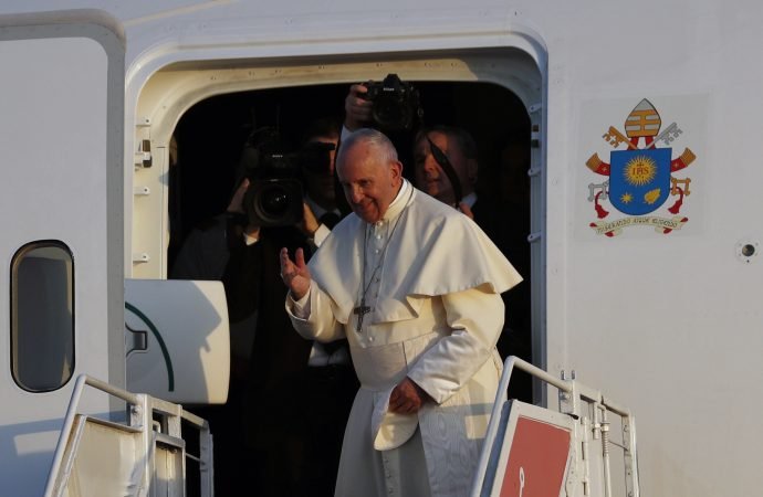 Pope Francis waves goodbye from his plane as he prepares to depart Tocumen Airport after a five-day visit