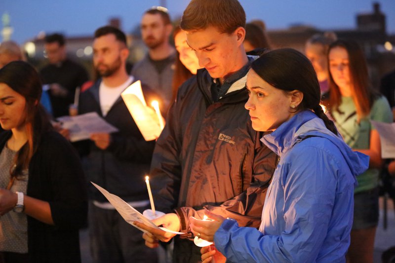 More than 100 young adults pray in front of the Cathedral of St. Pau in St. Paul