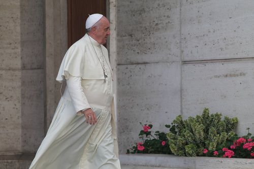 Pope Francis departs the Vatican's Synod Hall
