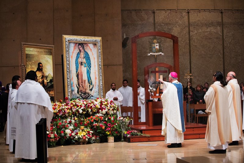 Archbishop Gomez blesses an image of Our Lady of Guadalupe. (Victor Alemán)