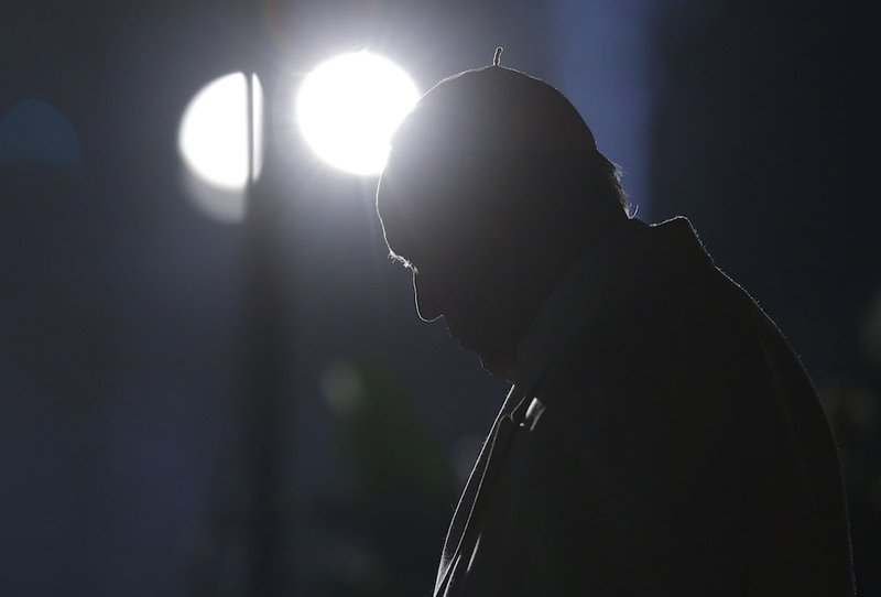 Pope Francis arrives to lead the Way of the Cross outside the Colosseum in Rome March 30. CNS PHOTO/PAUL HARING
