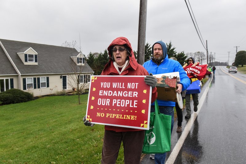 Protesters walk near a construction site of the Atlantic Sunrise pipeline in Holtwood