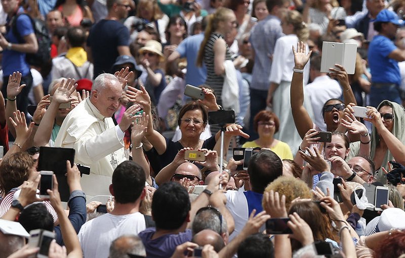 Pope Francis greets the crowd after celebrating a Mass for the Jubilee of Deacons in St. Peter’s Square at the Vatican May 29. The Mass was an event of the Holy Year of Mercy. (CNS photo/Paul Haring)