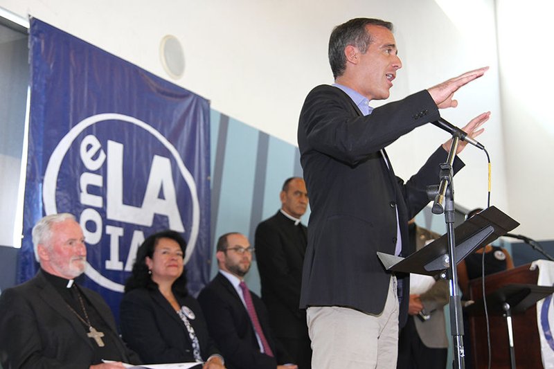 Los Angeles Mayor Eric Garcetti (at podium) and Bishop David O’Connell