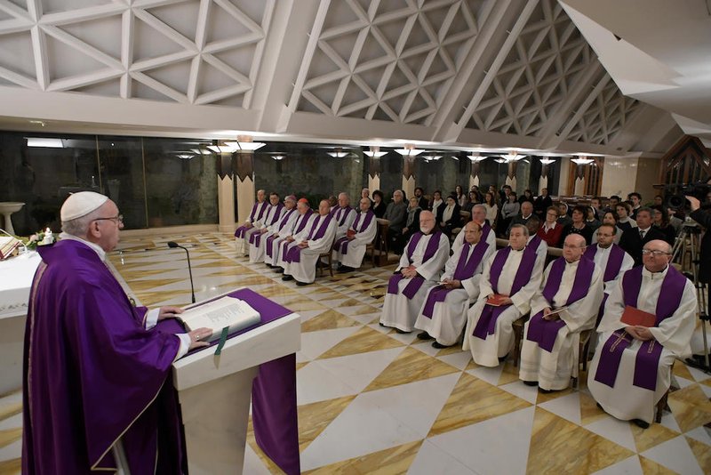 Pope Francis delivers the homily as he celebrates morning Mass in the chapel of his residence