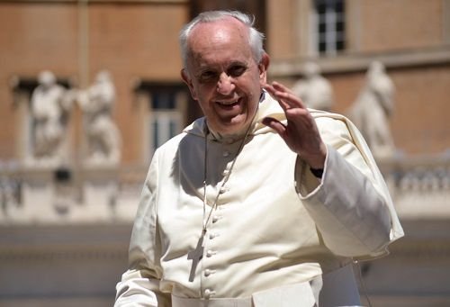 Pope Francis greets pilgrims during his general audience on May 14