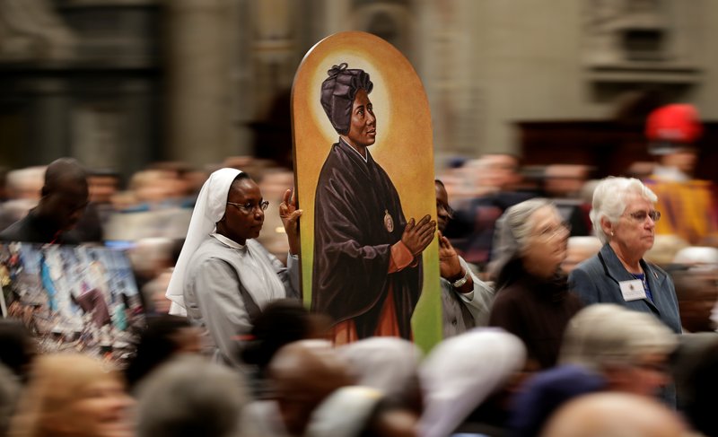 An image of Sudanese St. Josephine Margaret Bakhita is carried in procession during a prayer service led by Pope Francis for peace in South Sudan and Congo in St. Peter's Basilica at the Vatican November 23. (CNS photo/Max Rossi, Reuters) See POPE-PRAYER-PEACE-AFRICA Nov. 24, 2017.