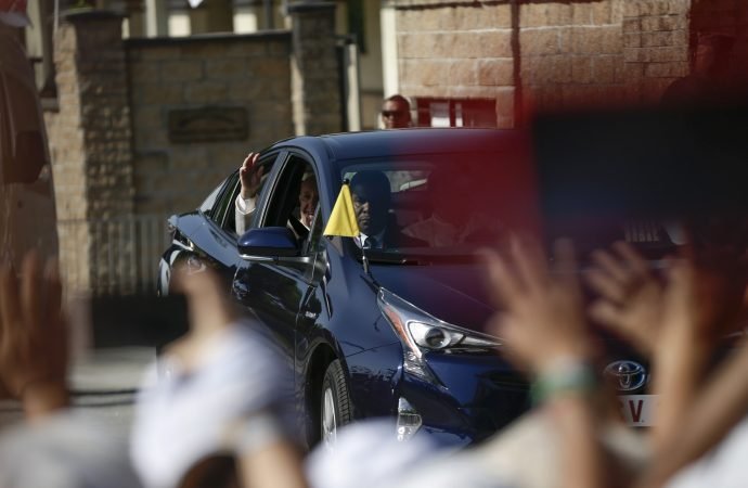 Pope Francis waves as he leaves the Apostolic Nunciature in Panama City