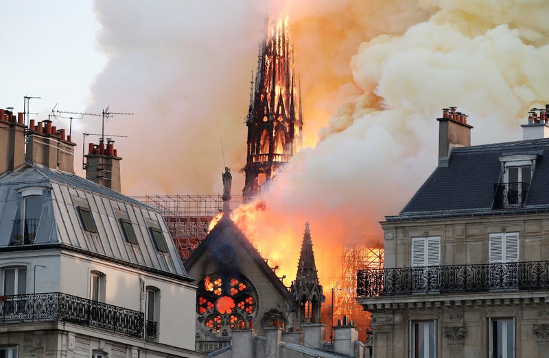 Flames and smoke billow from the Notre Dame Cathedral after a fire broke out in Paris April 15
