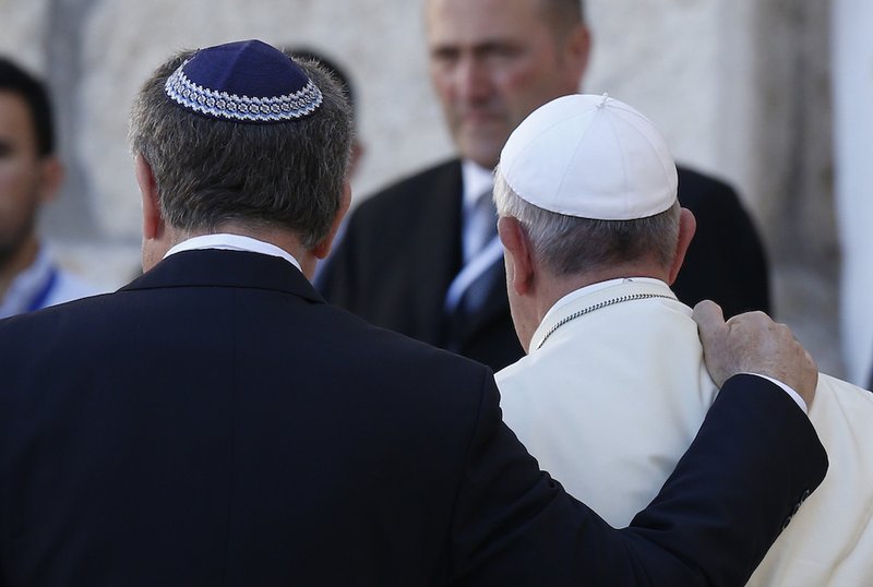 Rabbi Abraham Skorka of Buenos Aires and Pope Francis embrace after visiting the Western Wall in Jerusalem May 26