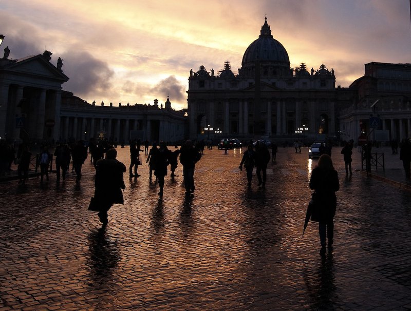 A sunset after a day of rain illuminates the cobblestones near the Vatican in Rome March 5