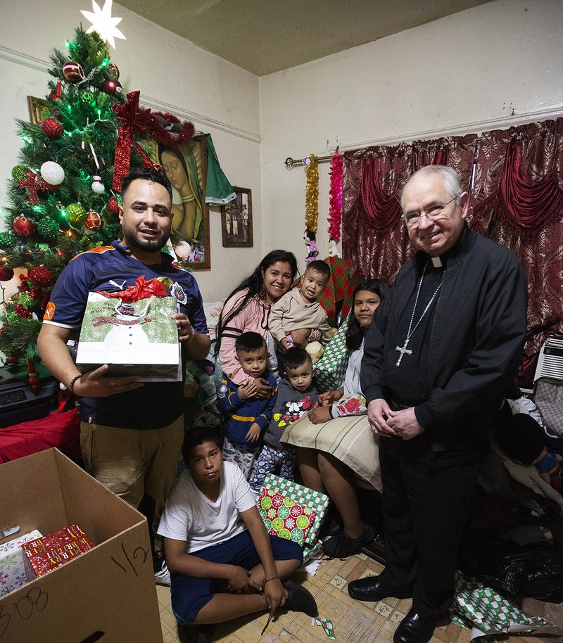 Archbishop Gomez delivered gifts and groceries to families in need as part of the Adopt-A-Family program Dec. 15. (VICTOR ALEMÁN/ANGELUS)