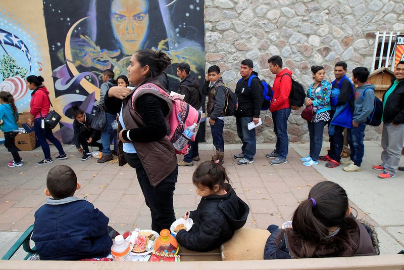 Central American migrants who were dropped off at a bus station in El Paso