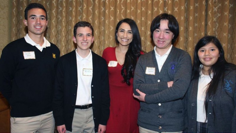 Teacher Monica Aguilar (center) poses with Cabrini Literary Guild Writing Award winners
