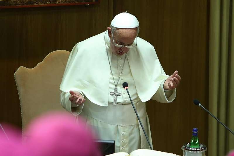 Pope Francis prays the Our Father while meeting with the Italian bishops' conference at the Vatican's Paul VI Hall