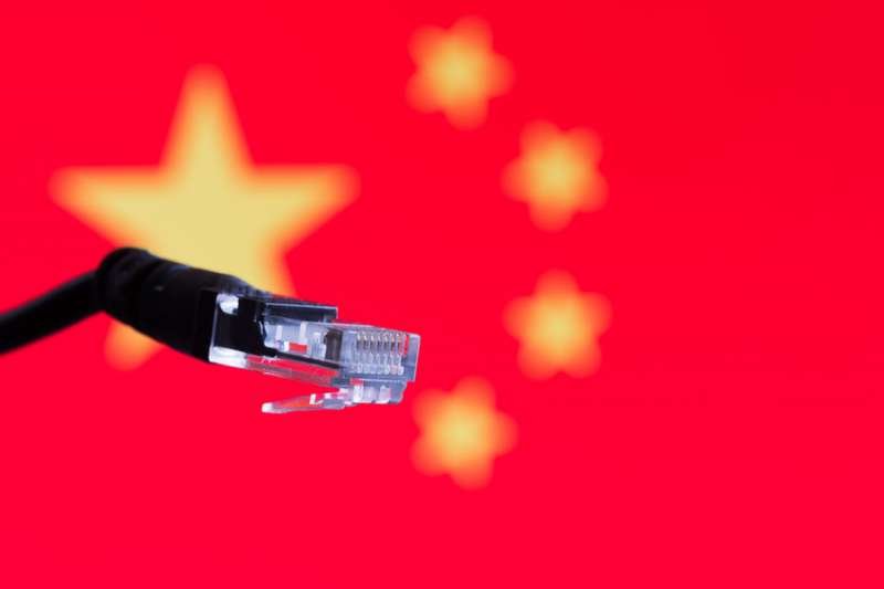 Ethernet cable with chinese flag in the background. Credit: LP2 Studio_Shutterstock