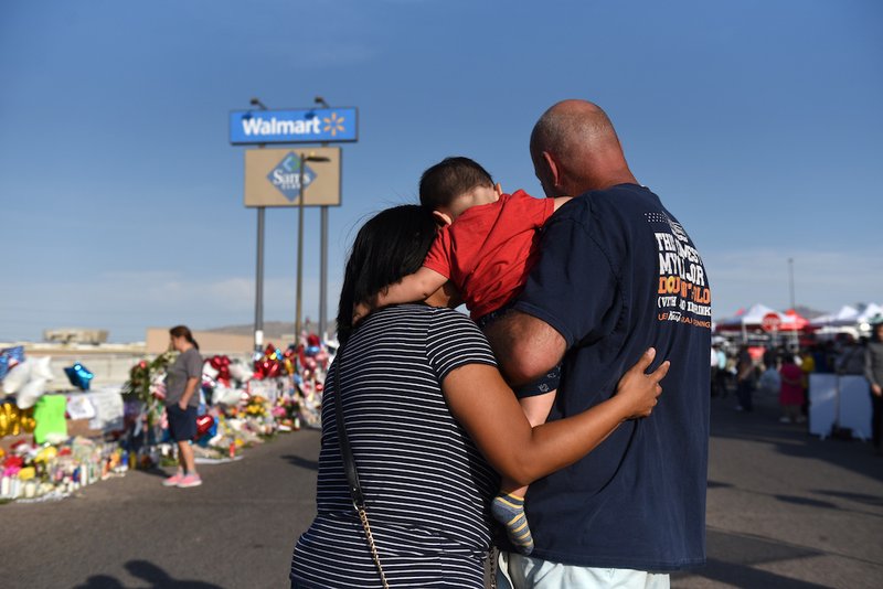 A family pays their respects Aug. 7