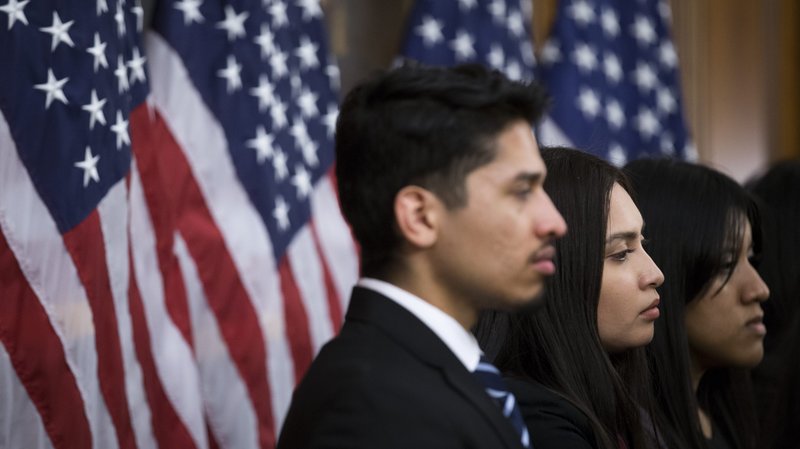 Recipients of the Deferred Action for Childhood Arrivals program, or DACA, listen to remarks during a news conference at the U.S. Capitol in Washington urging congressional action for "Dreamers." (CNS photo/Shawn Thew, EPA)
