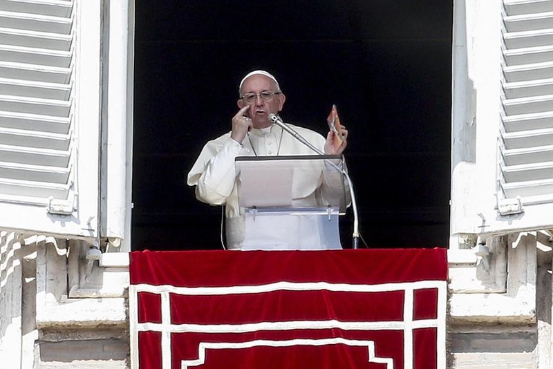 Pope Francis leads the Angelus Sept. 16 from the window of his studio overlooking St. Peter's Square at the Vatican. (CNS photo/Favio Frustaci