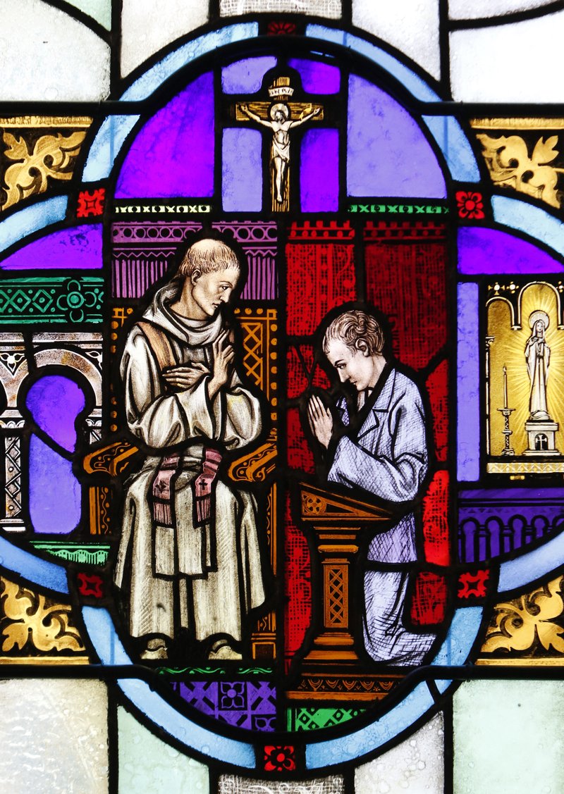The sacrament of reconciliation in a stained-glass window at St. Aloysius Church in Great Neck