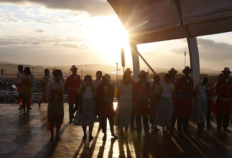 Young people wait onstage before Pope Francis' vigil with young people at the Soamandrakizay diocesan field in Antananarivo