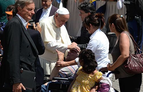 Pope Francis greets pilgrims in St. Peter's Square during the Wednesday General Audience
