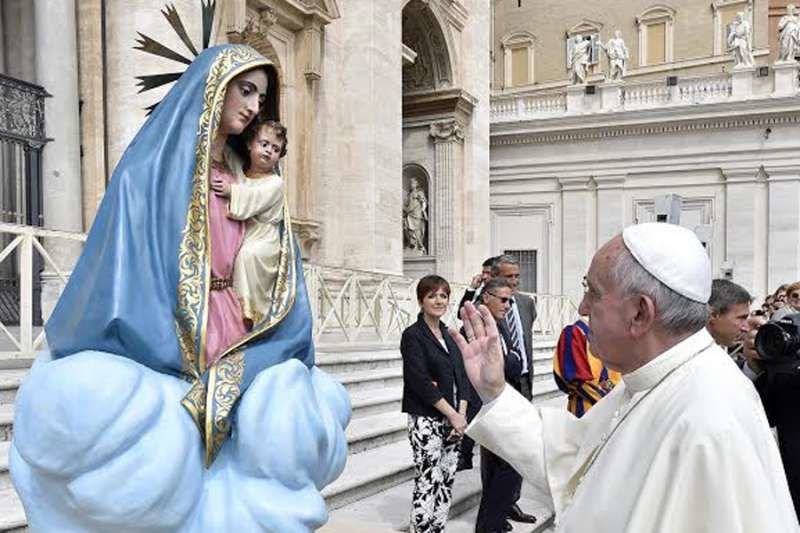 Pope Francis with a statue of Mary and baby Jesus in St. Peter's Square during the general audience on Sept 9
