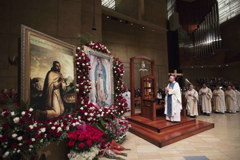 Archbishop Jose Gomez of Los Angeles venerates an image of Our Lady of Guadalupe at the Catheral of Our Lady of the Angels