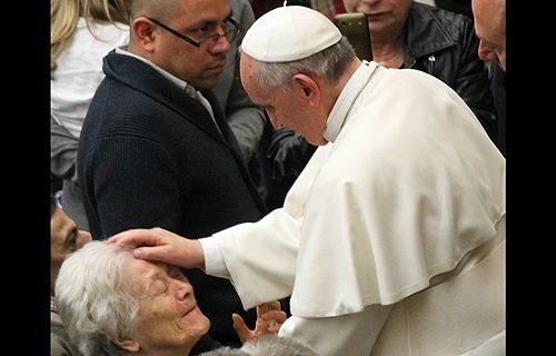 Pope Francis greets attendees at an audience for the deaf and blind March 29