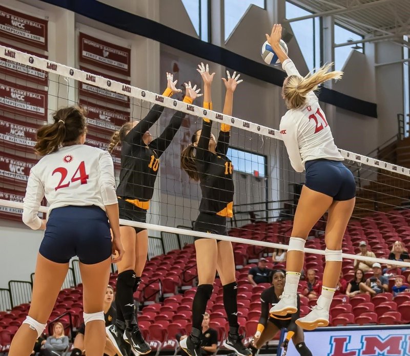 Junior Meredith Teague (21) drives home a winner for LMU