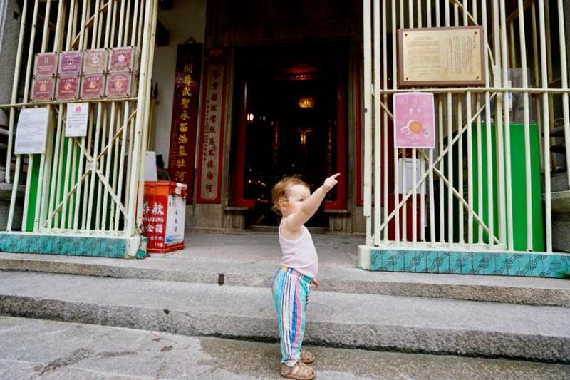A child standing at the entrance of a house in central Hong Kong. Credit: Wang Sing_Shutterstock