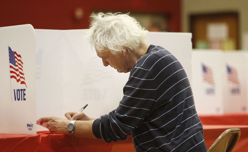 A man casts his ballot in Kent
