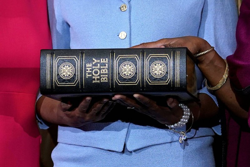 Rep. Sheila Jackson Lee (D-Texas) poses with a Bible Jan. 3 for a ceremonial swearing-in picture on Capitol Hill in Washington. (CNS photo/Joshua Roberts