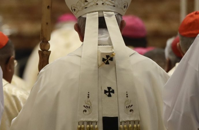 Pope Francis kisses the altar as he arrives in St. Peter's Basilica at the Vatican to celebrate a Mass with Caritas international members