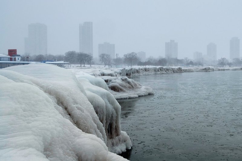 The banks of Lake Michigan are seen frozen with the Chicago skyline in the background Jan. 29