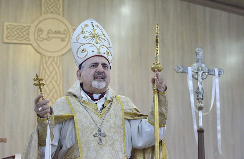 Syriac Catholic Patriarch Ignace Joseph III Younan speaks during an April 11 Mass in a displaced persons camp in Ankawa