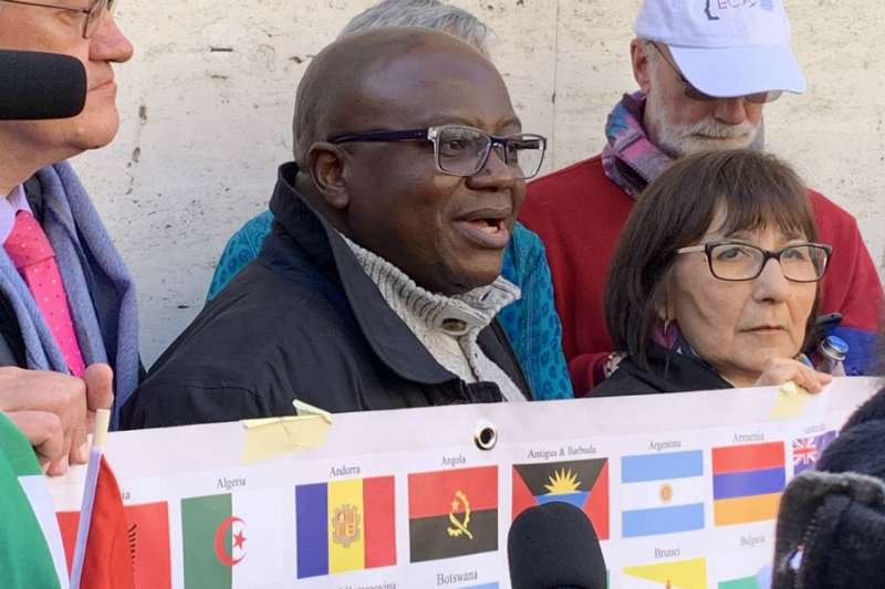Benjamin Kitobo (C) speaks at a gathering of clerical sex abuse victims and advocates outside St. Peter's Square