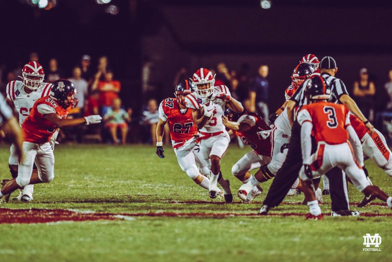 Marceese Yetts (#5 in white) breaks through tackles in this game against Centennial (AZ). (MDFootball/Twitter)