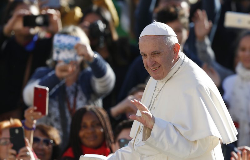 Pope Francis greets the crowd during his general audience in St. Peter's Square at the Vatican Oct. 24. (CNS photo/Paul Haring)