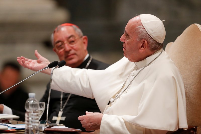 Pope Francis gestures as he addresses more than 1