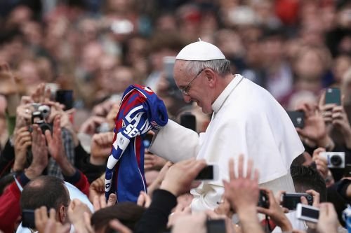 Pope Francis is given a San Lorenzo's jersey in St. Peter's Square on March 31