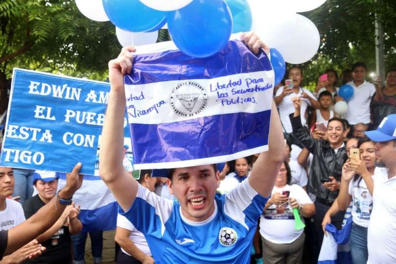 Edwin Carcache demonstrates demanding the release from prison of other opposition prisoners after his own release in Managua