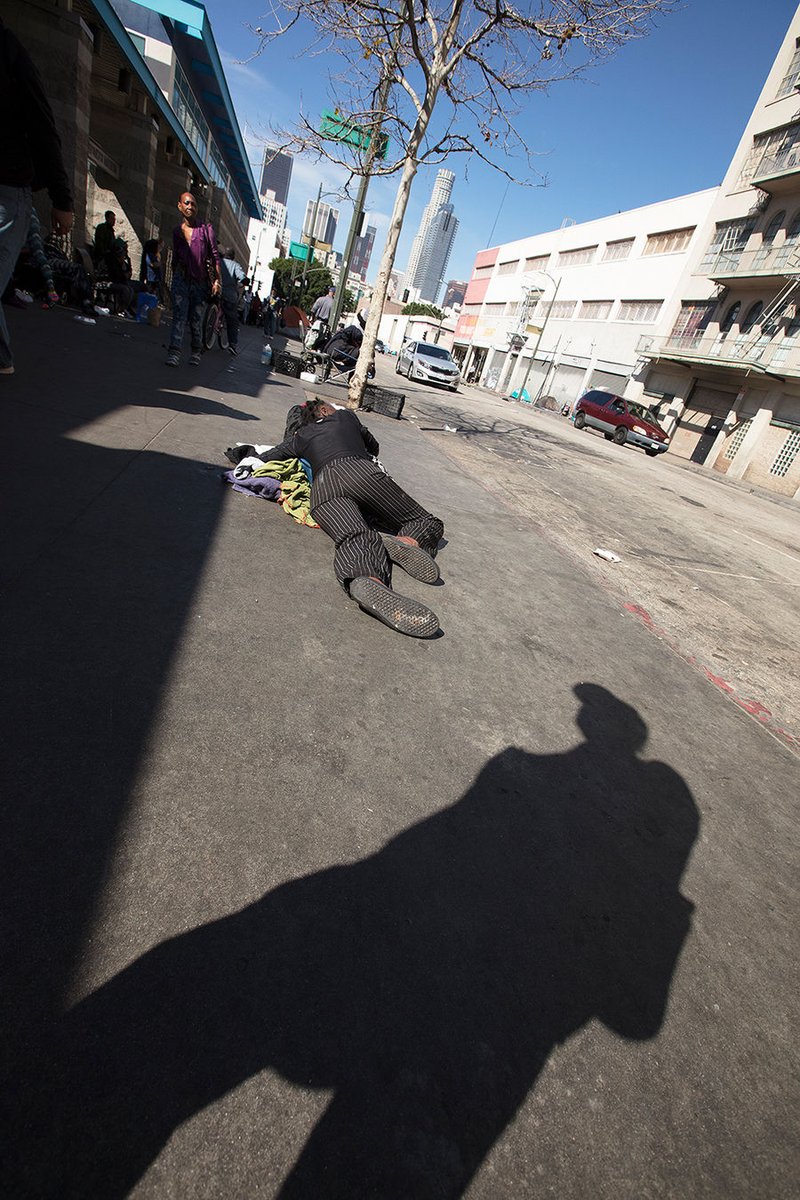 A homeless woman sleeps on Skid Row. (photo/R.W. Dellinger)
