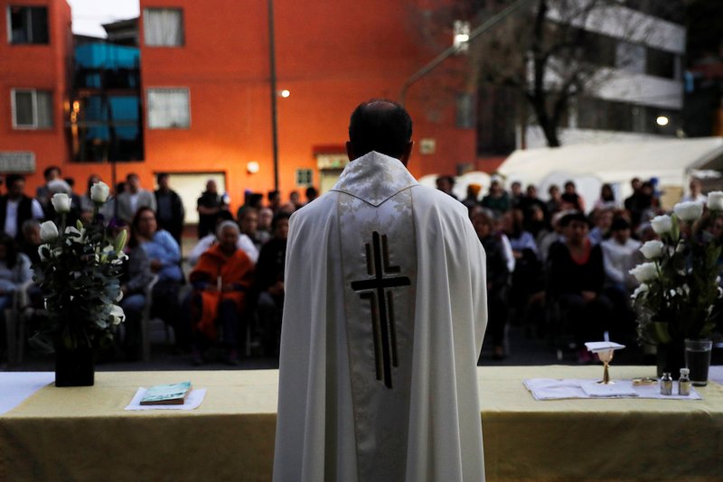 A priest in Mexico City celebrates Mass Jan. 11, 2018. The Mexican bishops' conference presented an action plan March 5 for preventing minors from sexual abuse by clergy and pastoral agents; it also addressed the cases of abuse that have occurred. (CNS photo/Carlos Jasso, Reuters)