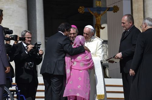 Pope Francis greets Paul Bhatti and his mother in St. Peter's Square during the Wednesday general audience on Aug. 27