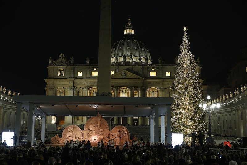 The Christmas tree and "Sand Nativity" are seen after a lighting ceremony in St. Peter's Square at the Vatican Dec. 7. (CNS photo/Paul Haring)