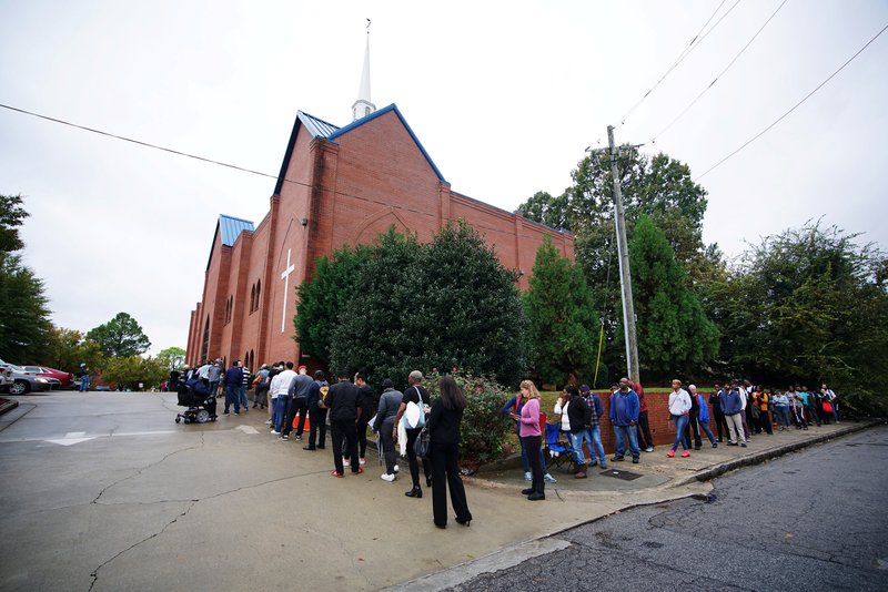 A line of voters wraps around Our Lady of Lourdes Catholic Church in Atlanta during midterm elections Nov. 6. (CNS PHOTO/LAWRENCE BRYANT